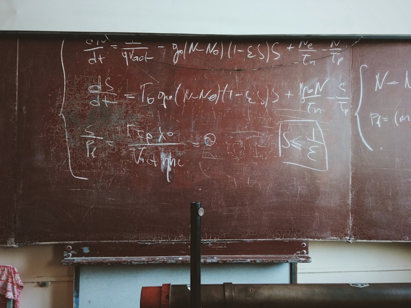 Mathematical equations on a chalkboard representing rigorous derivation